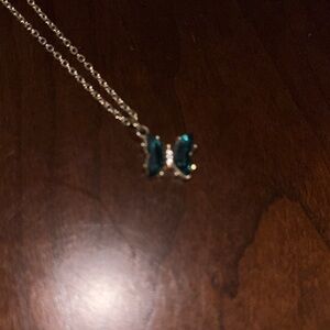 Claire’s Gold toned Necklace with teal butterfly Pendant